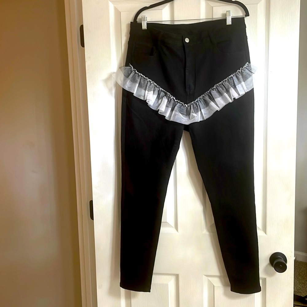 Black denim jeans with Blk/white tulle material ruffle. Good stretch.